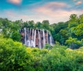 Picturesque morning csene of Plitvice National Park. Romantic spring sunrise among green forest with pure water waterfall. Great Royalty Free Stock Photo
