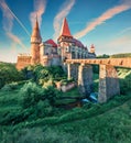 Picturesque morning view of Hunyad Castle / Corvin`s Castle. Unbelievable summer sunrise in Hunedoara, Transylvania, Romania,