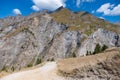 Picturesque mountain road winding through a green landscape Royalty Free Stock Photo