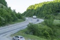 Picturesque mountain serpentine road with green forest peaks of the Caucasus Mountains