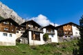 Picturesque mountain village with white stone houses and stone roofs in the Swiss Alps