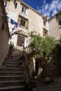 Picturesque narrow street with stone houses. Trogir, Dalmatia, Croatia, Europe Royalty Free Stock Photo