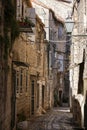 Picturesque narrow street with stone houses. Trogir, Dalmatia, Croatia, Europe Royalty Free Stock Photo