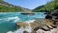 Picturesque Niagara River Rock with a powerful cascade of water flowing over rocks