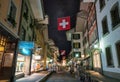 Picturesque nightscape of illuminated Upper Main street of Thun, Switzerland under starry sky