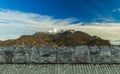 Picturesque Norway mountain lonely snowy peak landscape wallpaper nature background scenic view concept with stone wall and paved Royalty Free Stock Photo