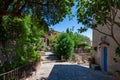 Picturesque old alley in the village of Bormes-les-Mimosas, France