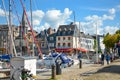 The picturesque old pier and harbor at Honfleur, France, on the Normandy Coast of the English Channel on a sunny afternoon as a co
