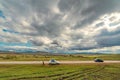 Picturesque panorama from the road to the village and mountains on the horizon