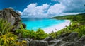 Picturesque panoramic shot of Grand Anse, La Digue island, Seychelles. Huge granite rock formation, bright white sand Royalty Free Stock Photo
