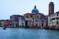 Picturesque panoramic view over Grand Canal in Venice. Moored boats near colorful ancient buildings Royalty Free Stock Photo