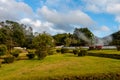 Picturesque park with evaporation from natural active geysers at Royalty Free Stock Photo