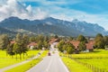 picturesque and peaceful village with a road in the Alps. Travel and tourism concept Royalty Free Stock Photo