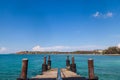 a picturesque pier at the rafai beach pier going under water with steps. Clear turquoise water and blue sky. Travel and recreation Royalty Free Stock Photo