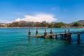 a picturesque pier at the rafai beach pier going under water with steps. Clear turquoise water and blue sky. Travel and recreation Royalty Free Stock Photo