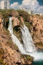 powerful Duden waterfall, a water stream breaks from a high cliff - this is a very popular place for tourists and Royalty Free Stock Photo