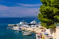 Picturesque promenade with boats and public beach