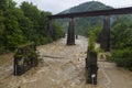 Two bridges over a stormy mountain river