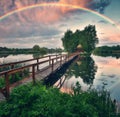 picturesque rainbow over a wooden hut on a small island Royalty Free Stock Photo