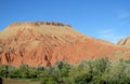 Picturesque red mountain and green froest at the bottom Royalty Free Stock Photo