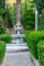 Picturesque refreshing fountain in the garden Royalty Free Stock Photo