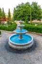 Picturesque refreshing fountain in the garden Royalty Free Stock Photo