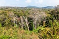 Picturesque road in mountains of National park Bokor leading to Abandoned hotel Bokor Palace in Ghost town Hill station near Kampo Royalty Free Stock Photo