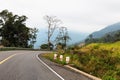 Picturesque road in mountains of National park Bokor leading to Abandoned hotel Bokor Palace in Ghost town Hill station near Kampo Royalty Free Stock Photo