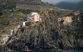 Village of Manarola with colourful houses at the edge of the cliff Riomaggiore, Cinque Terre, Liguria, Italy