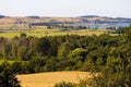 Picturesque rural farmstead situated in a grassy meadow surrounded by a body of still water, Germany