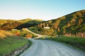 Picturesque rural house on a hill and rural road, Mahia Peninsula, New Zealand