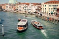 Picturesque scene of boats gently floating in a canal surrounded by historical buildings