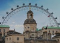 London Eye behind bell tower of horse guards in London Royalty Free Stock Photo