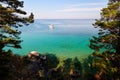 Picturesque seascape. Yacht in a bay with turquoise water color.