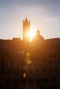 Picturesque silhouette view of Siena Cathedral Santa Maria Assunta (Duomo) at sunset golden hour, Tuscany, Italy. Scenic travel Royalty Free Stock Photo