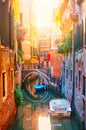 Picturesque small canal with bridge and boats in Venice Royalty Free Stock Photo