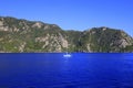 Picturesque spring, summer seascape. Yacht at sea in Turkey, against the backdrop of high mountains, near Bodrum and Marmaris,