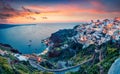 Picturesque spring sunset on the famous Greek resort Oia, Greece, Europe.