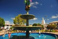 square with a garden of exotic flowers and sculptures of water fountain figures, moyobamba san martin peru -october