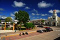 square with a garden of exotic flowers and sculptures of water fountain figuresand The St. James Cathedral main