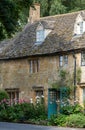 Stone cottages around the village green, photographed in the pretty Cotswold village of Snowshill near Broadway, UK