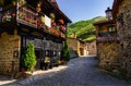 Picturesque stone houses with black wooden facade and narrow stone alley. Barcena Mayor Santander