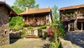 Picturesque stone houses in mountain village with plants and flowers. Barcena mayor