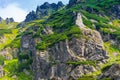 Picturesque stone mountains of the Tatry covered with green plan