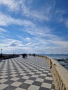 Picturesque stone walkway, surrounded by ancient stone pillars in Terrazza Mascagni, Livorno, Italy