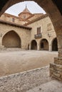 Picturesque stoned arcaded square in Spain. Cantavieja, Teruel.
