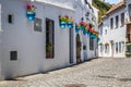 Picturesque street of Mijas with flower pots in facades. Andalusian white village. Costa del Sol. Southern Spain Royalty Free Stock Photo