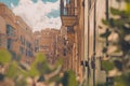 Picturesque streets and alleys of Valletta, Malta on summer sun. Visible long facades and balconies on them