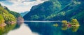 Picturesque summer panorama with small island with typical Norwegian building on Lovrafjorden flord, North sea. Colorful morning