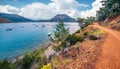 Picturesque summer seascape of Mediterranean sea. Colorful morning view of Adrasan beach with Moses Mountain and old country road,